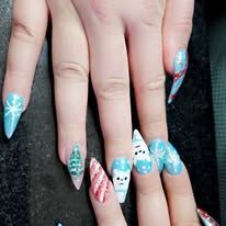 Hand with long blue, white, and pink decorated acrylic nails