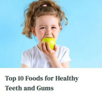 A little girl is eating an apple on a blue background.