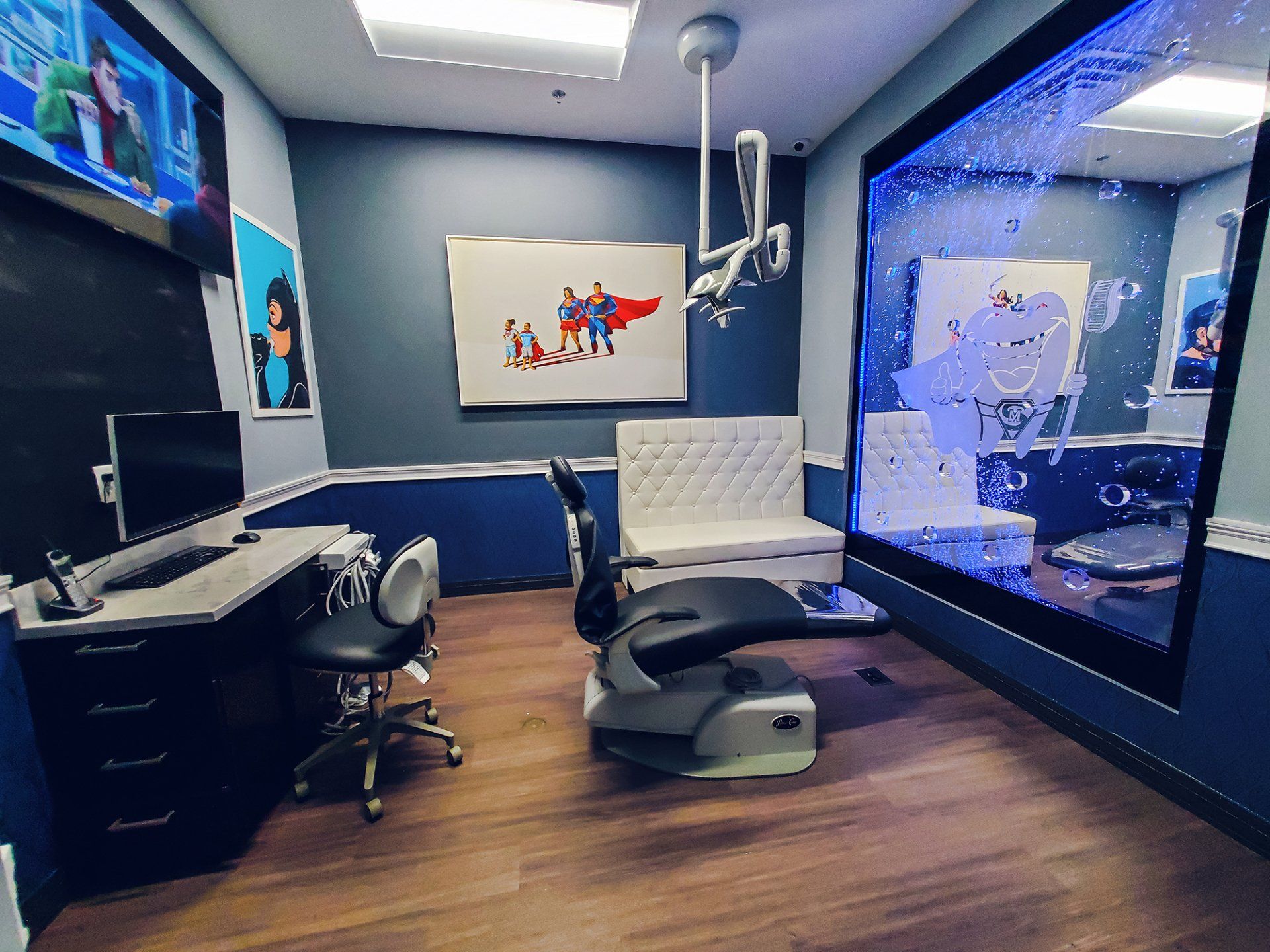 Mighty Smiles Dental, Dallas & Fort Worth. Lobby Mighty Smiles Dental, Dallas & Fort Worth. A dental office with a couch , chair , desk and computer.