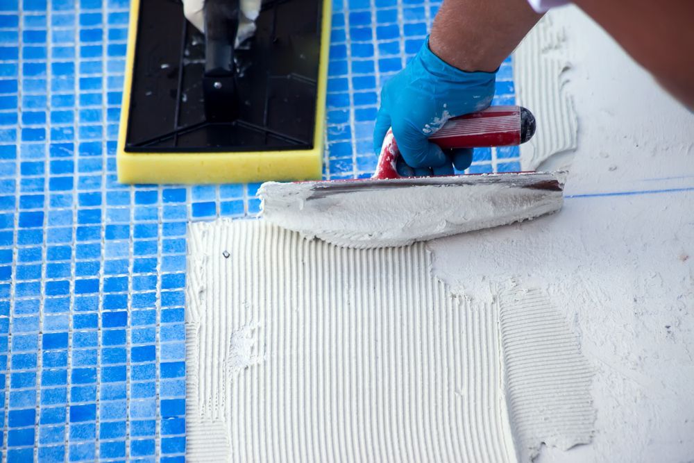 mosaic tiles putting on pool