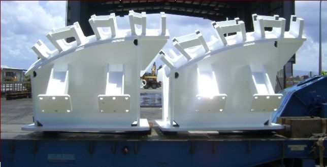 Two Large, White Industrial Components on a Blue Platform, Possibly Outdoors — Tincone Pty Ltd in Paget, QLD