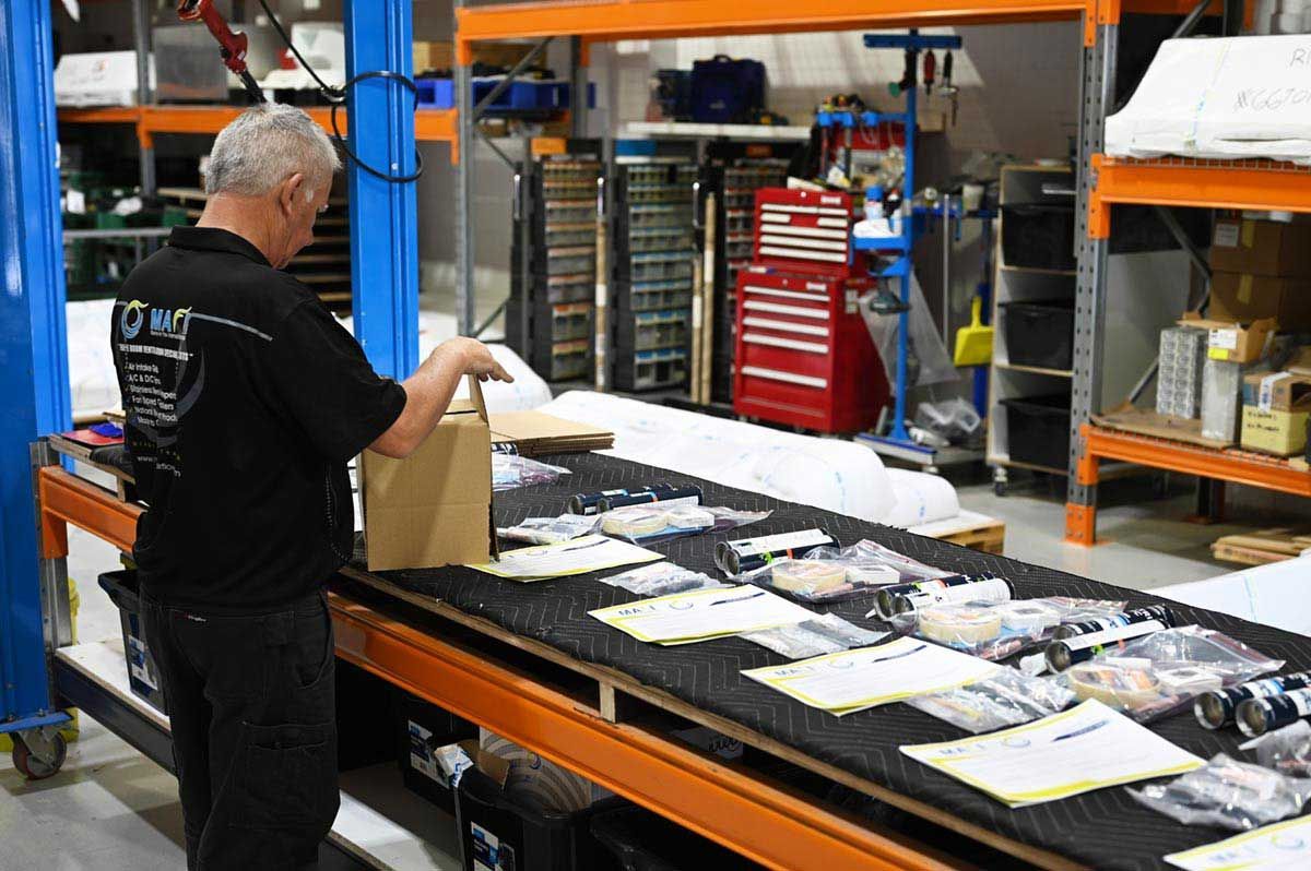 Matt from our QA and Dispatch team putting together install kits.