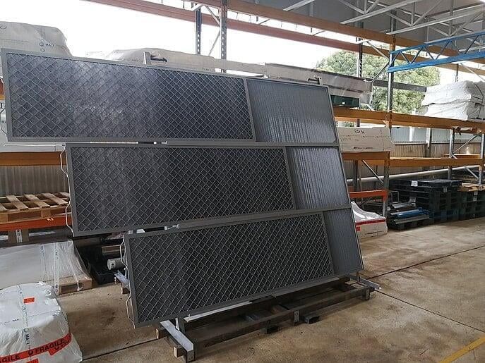 Air intake grilles with coalescing filter frames