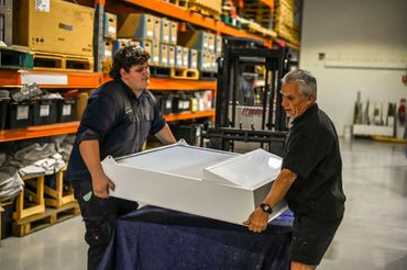 Our team handling a large intake grille with dorade.