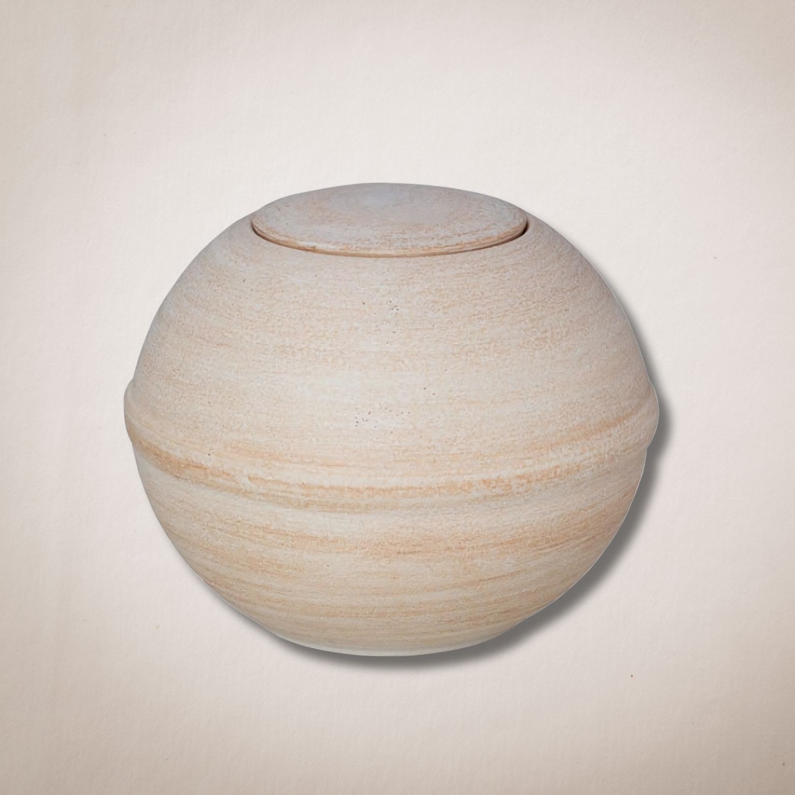 Een witte bal met een deksel erop