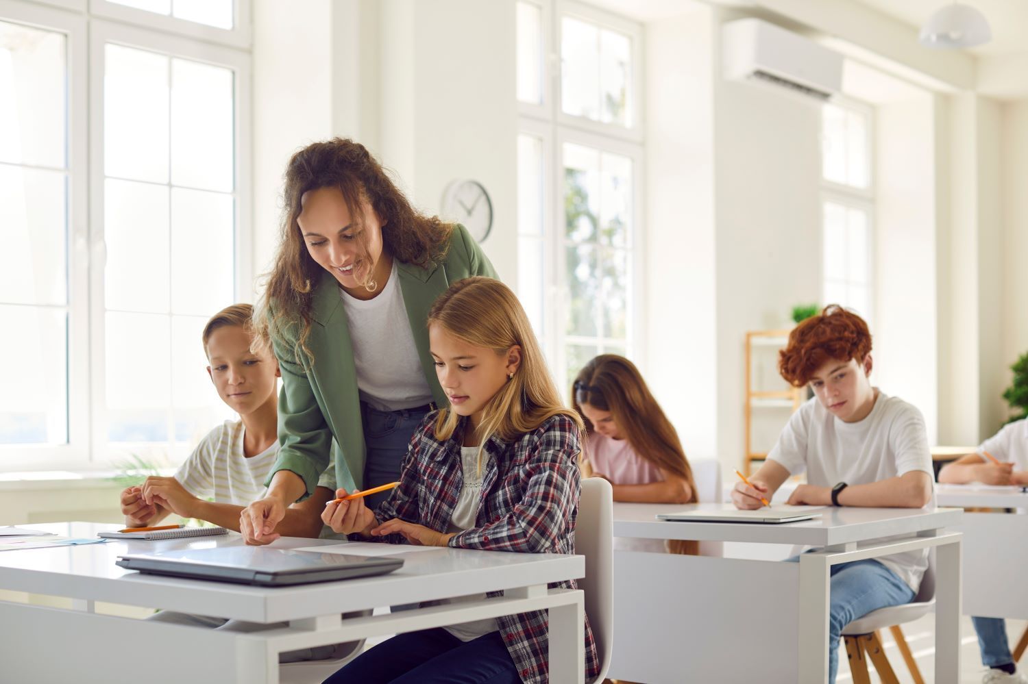 Teacher Engages In Teamwork In The School Classroom — Eleos Support Services In Lavington, NSW