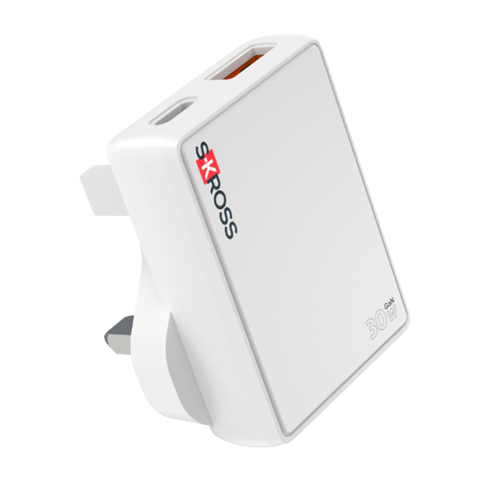 White SKROSS travel adapter with USB port, angled view on plain background