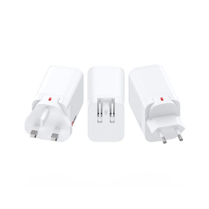 Three white interchangeable plug adapters with EU and UK prongs on a white background