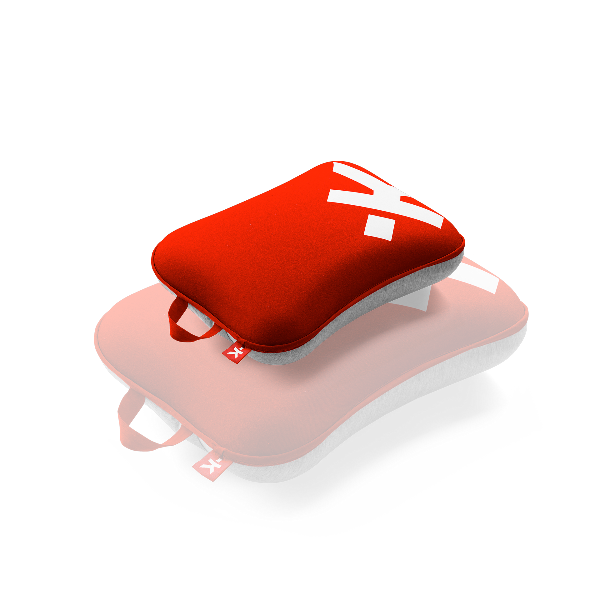 A red and white pillow with the letter x on it