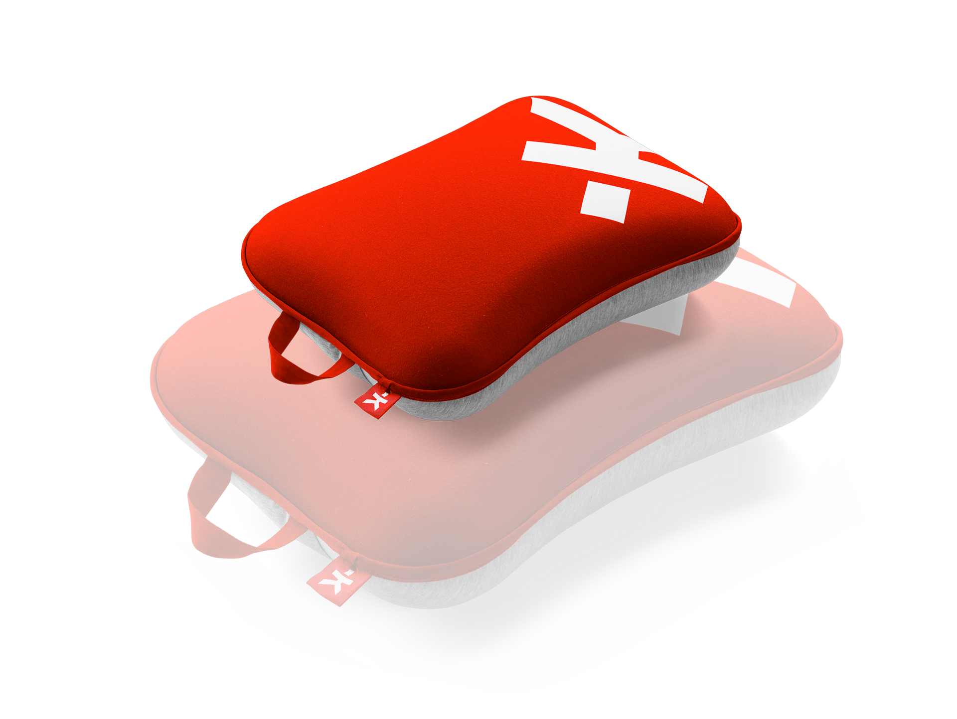 A red and white pillow with the letter x on it