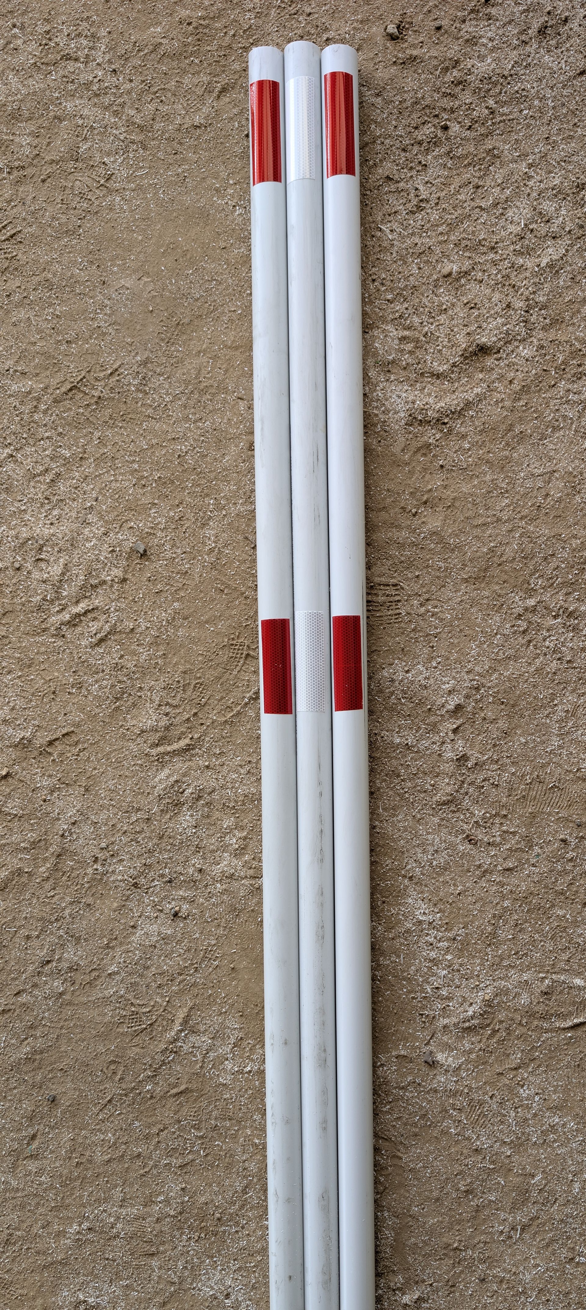 Mine site marker with red and white reflective tape