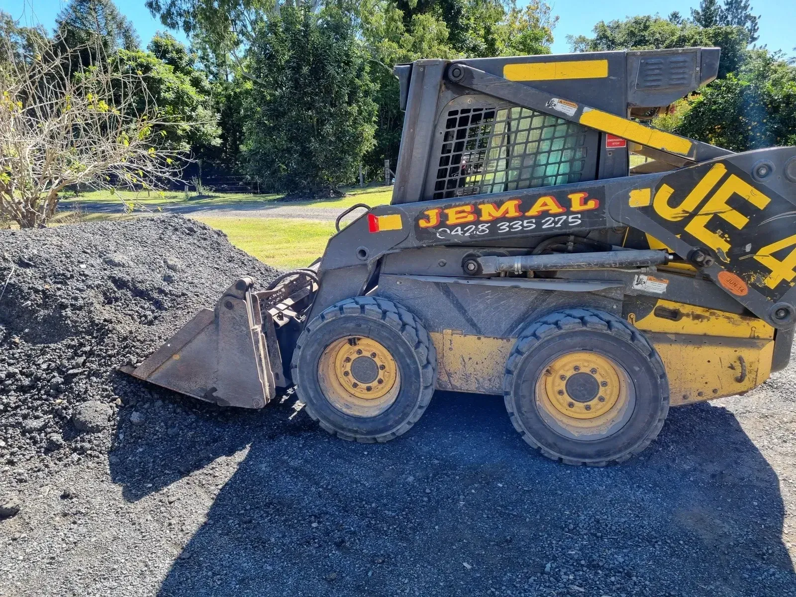 Yellow and Black Skid Steer Loader — Jemal Enterprises In Finch Hatton, QLD