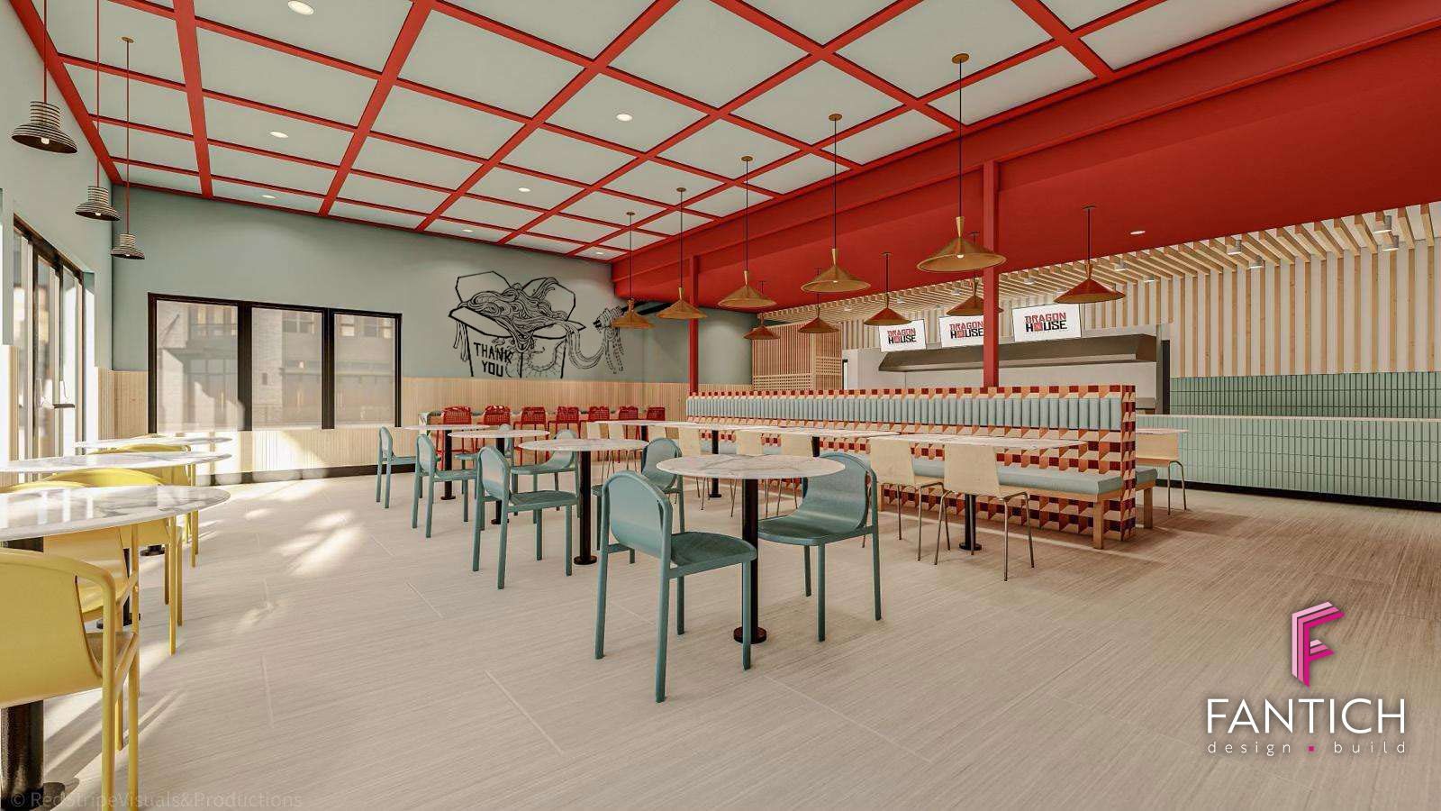 Bright modern cafeteria with red ceiling accents and rows of tables and chairs in a sunlit room