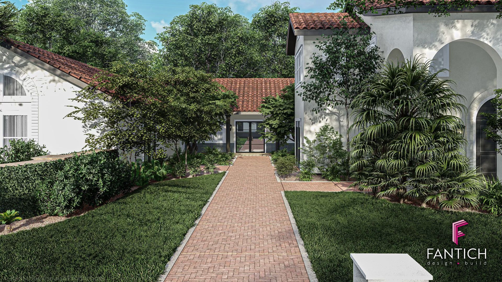 Brick path through a manicured garden leading to a white stucco building with red-tiled roofs and arches