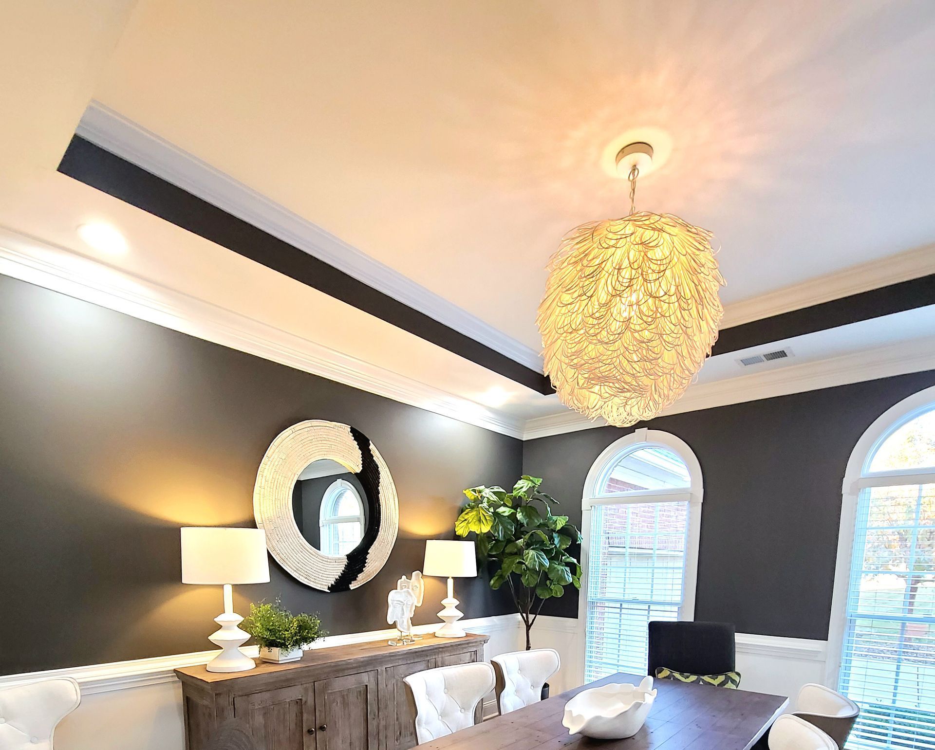 modern dining room boasts a black dining table