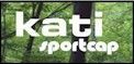 A logo for kati sportcap with trees in the background.