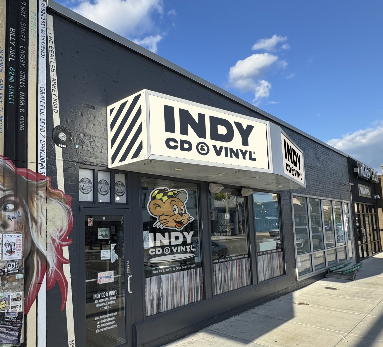 Exterior of Minus Skate Shop storefront with brick facade and large window displays