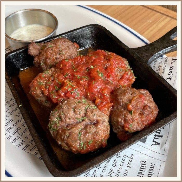 Lamb Meatballs in a cast-iron skillet.