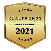 A gold badge that says real trends five hundred company 2021