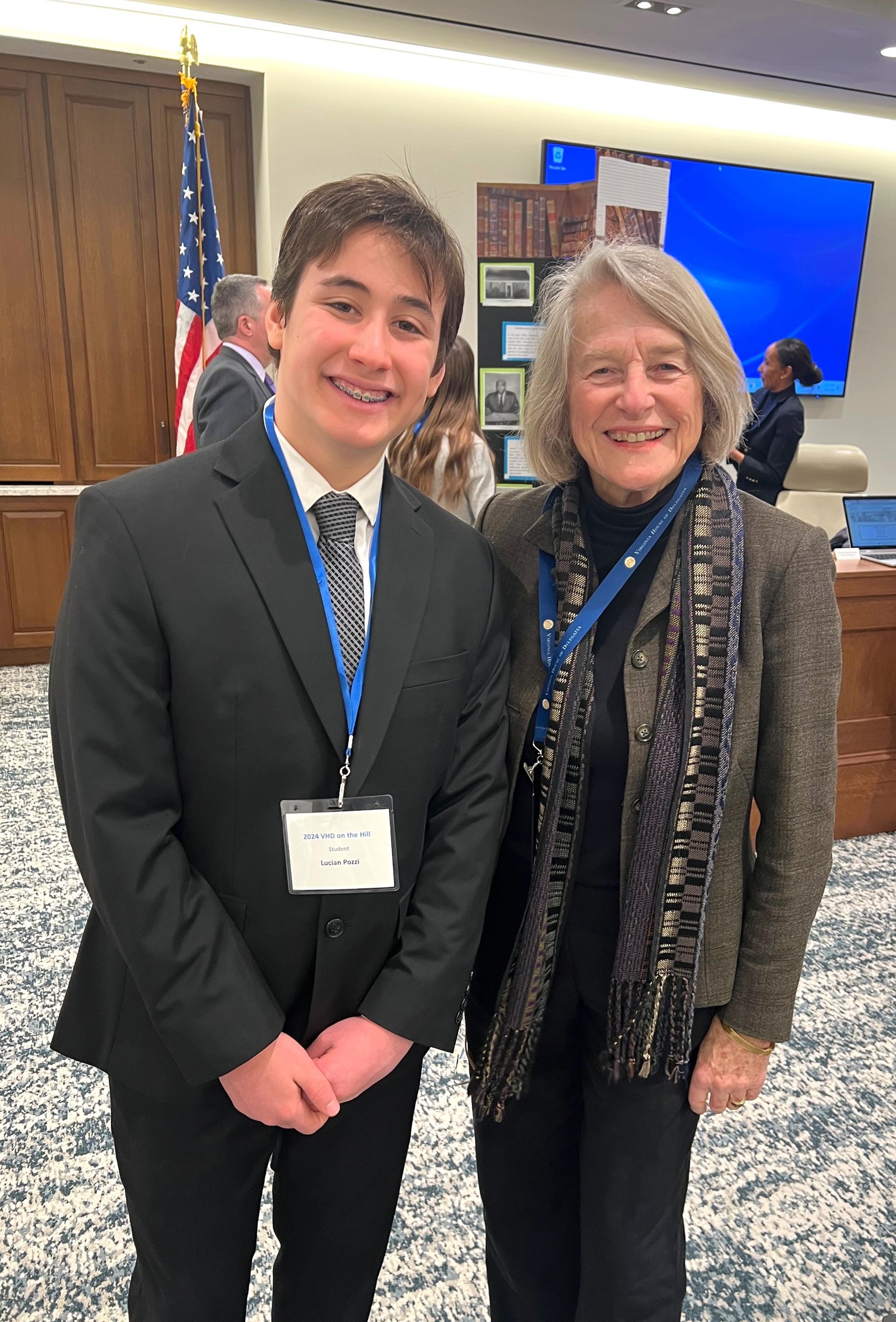 An 8th grader presents his report to Betsy Carr