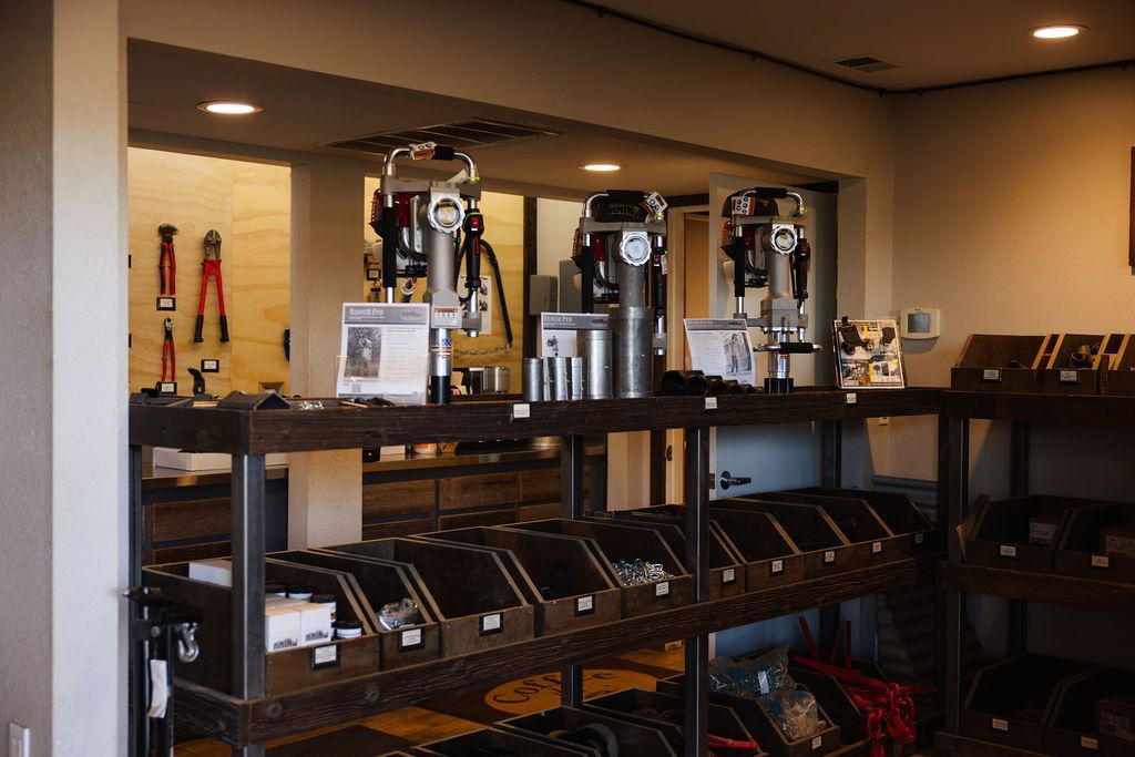Workshop shelves with espresso machines and coffee equipment in a recessed display area