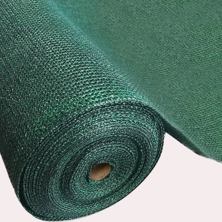 Rolled green mesh fabric roll with a visible cardboard core