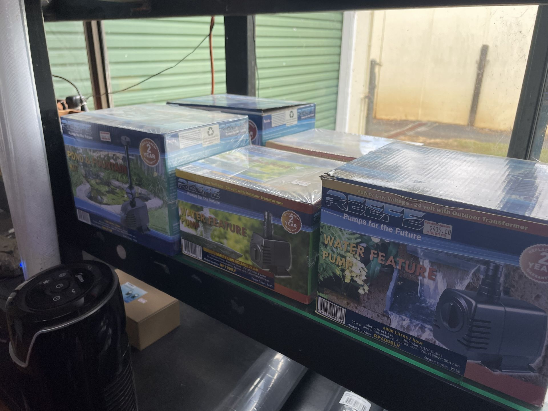 Stack of Boxed Water Feature Pumps, Black with Colorful Packaging — Summerland Aquarium in Wollongbar, NSW