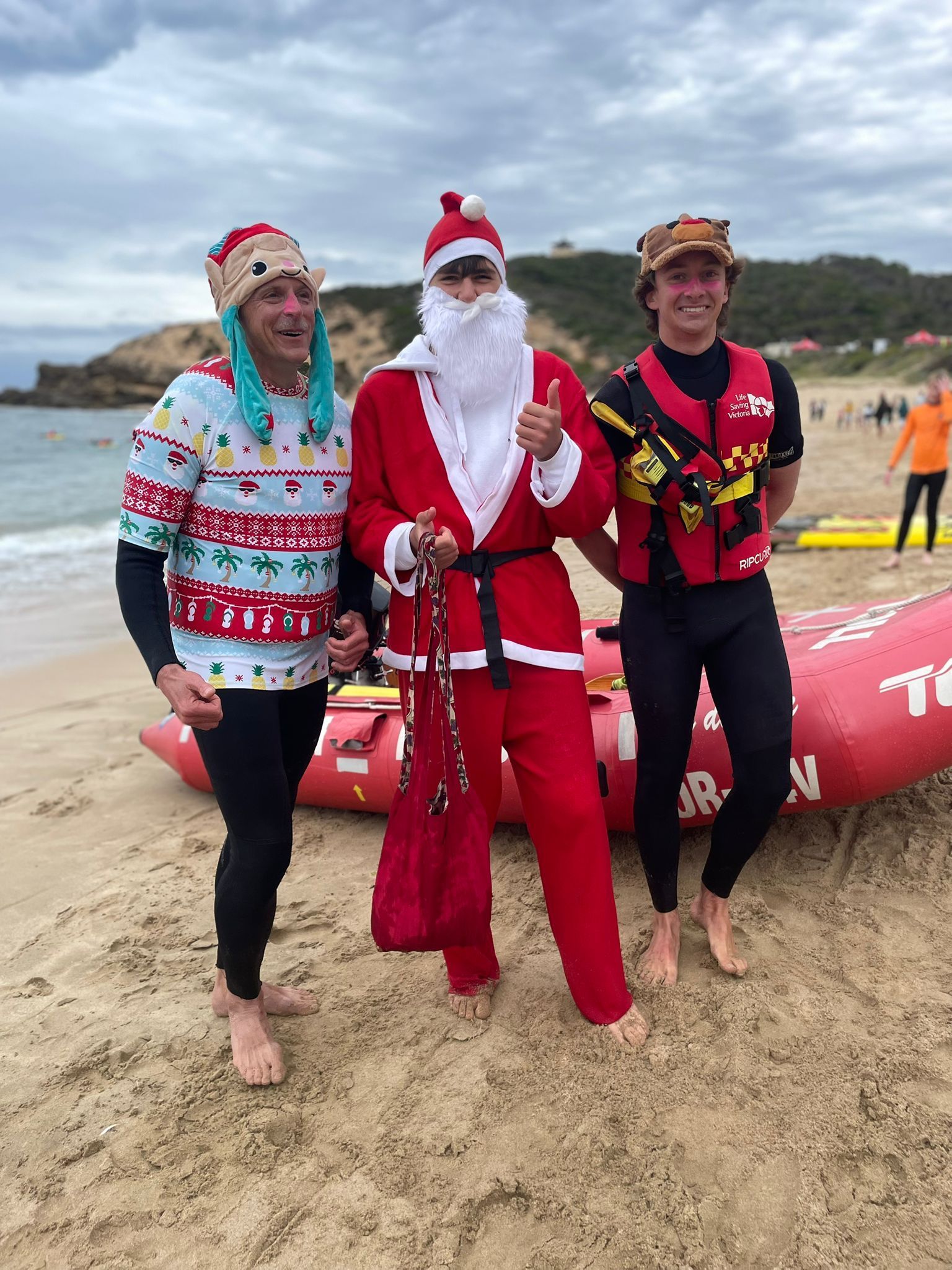 Santa and Helpers on the Beach