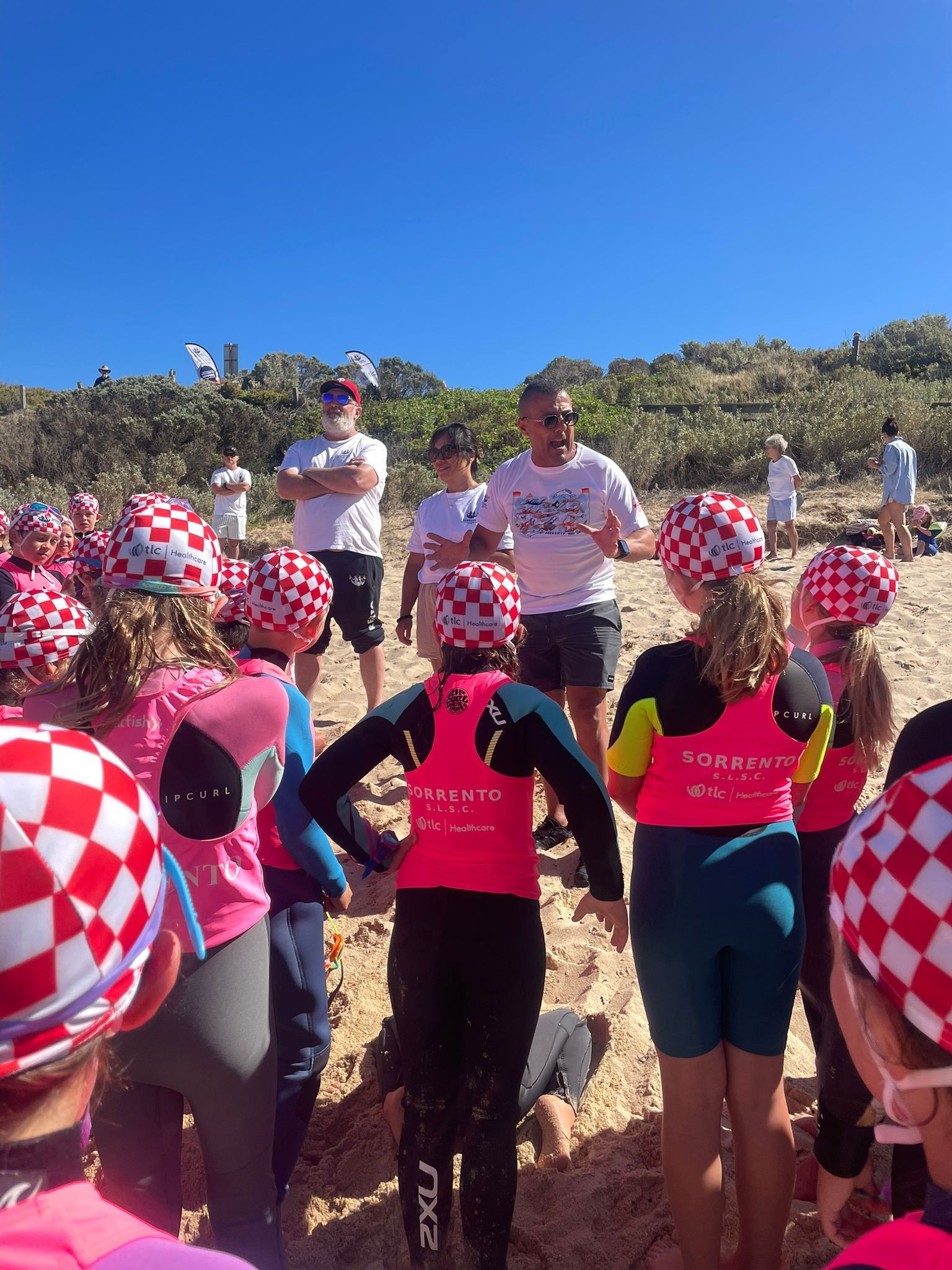 Lou talking to Nippers in TLC Healthcare caps and rash vests