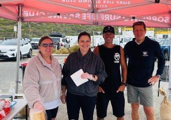 Four nipper parent volunteers at the beach car park.