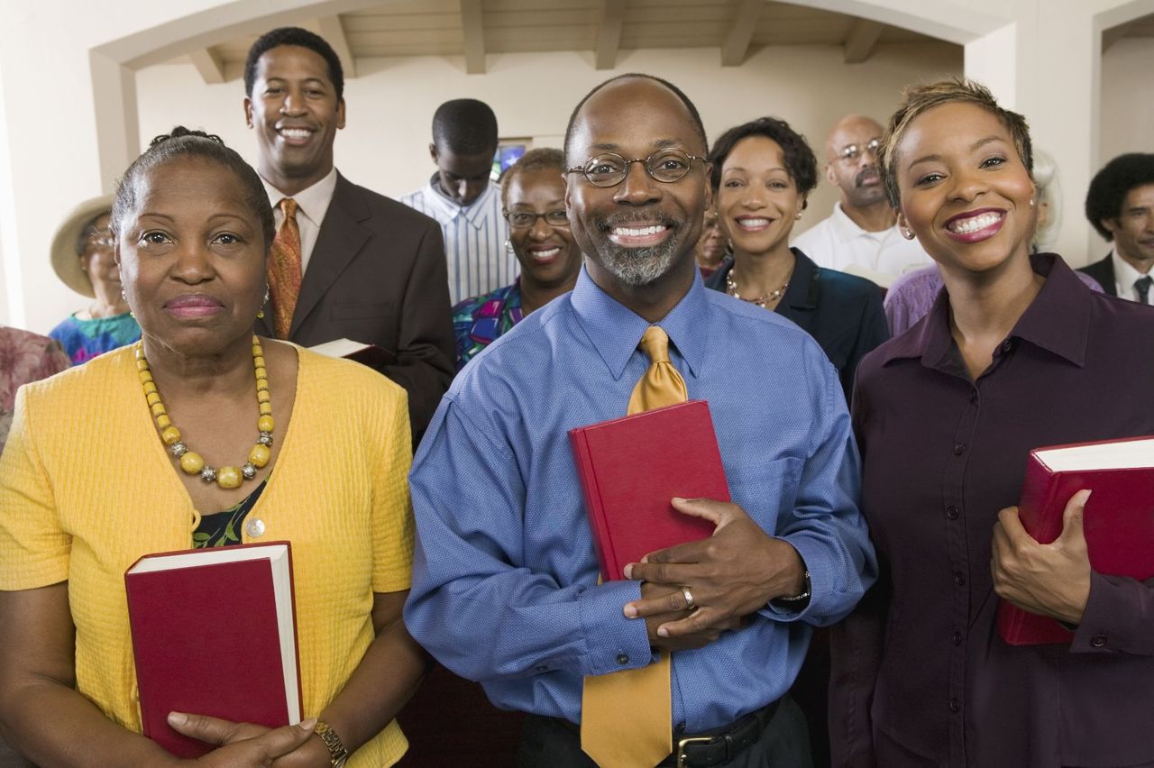 People Holding Red Bible — Oxford, NC — New Hope Granville Missionary Baptist Church