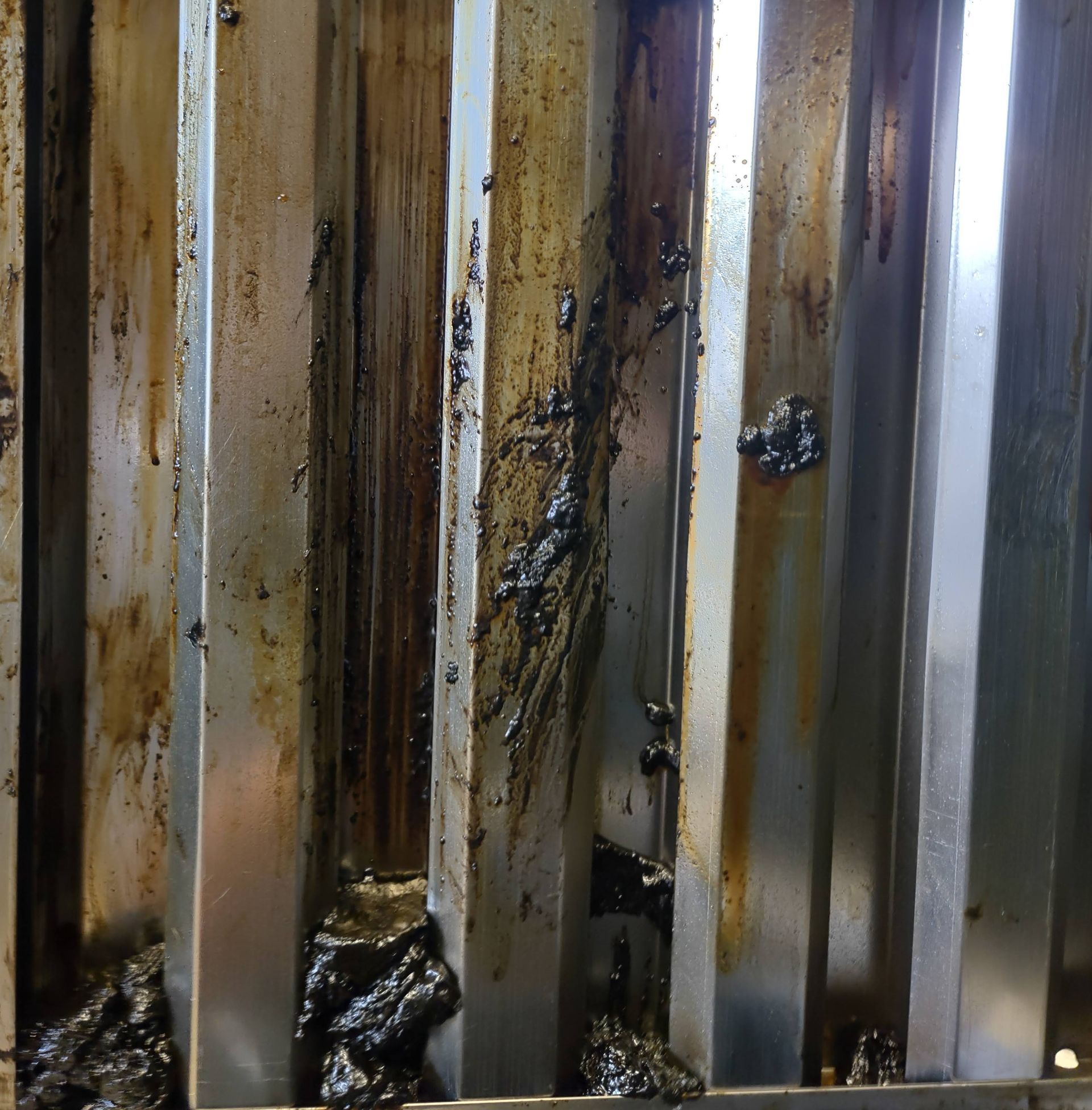 A dirty grill with a lot of stains on it