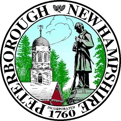 The seal of peterborough new hampshire shows a statue of a soldier and a church.