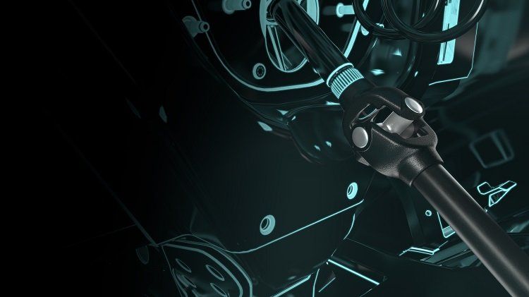 A close up of a wrench on a black background.