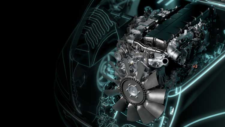 A close up of a car engine on a black background.