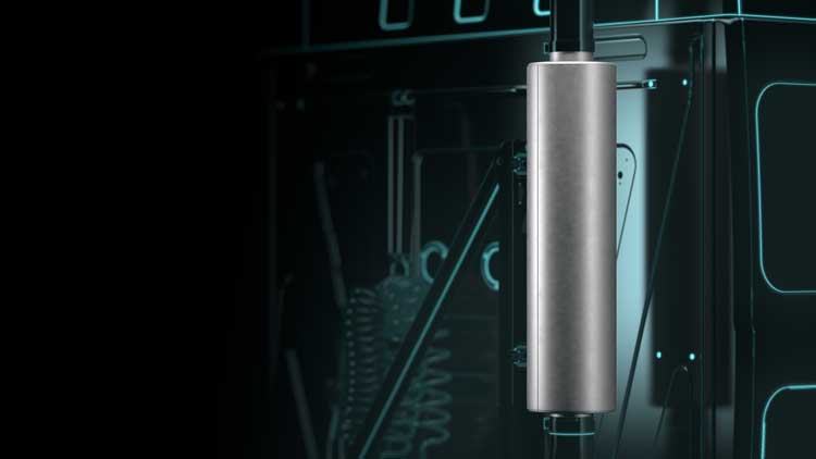 A close up of a metal object in a dark room.