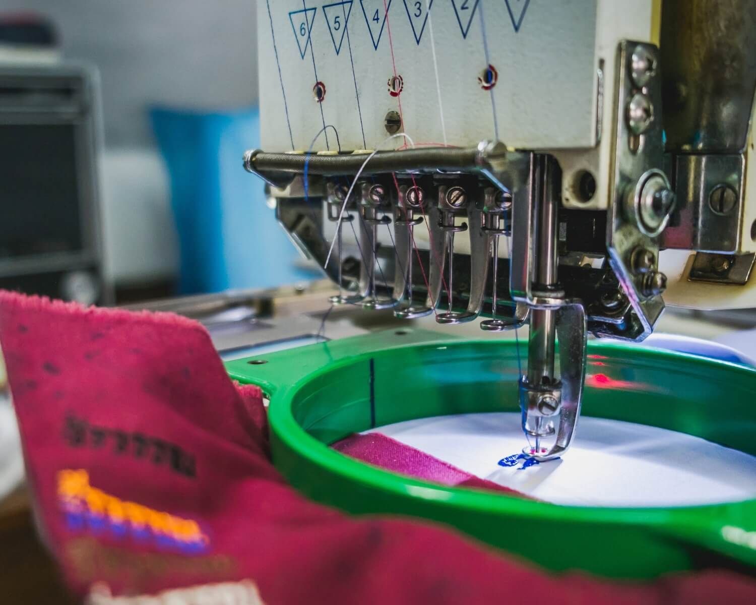 A close up of a sewing machine embroidery on a piece of fabric.