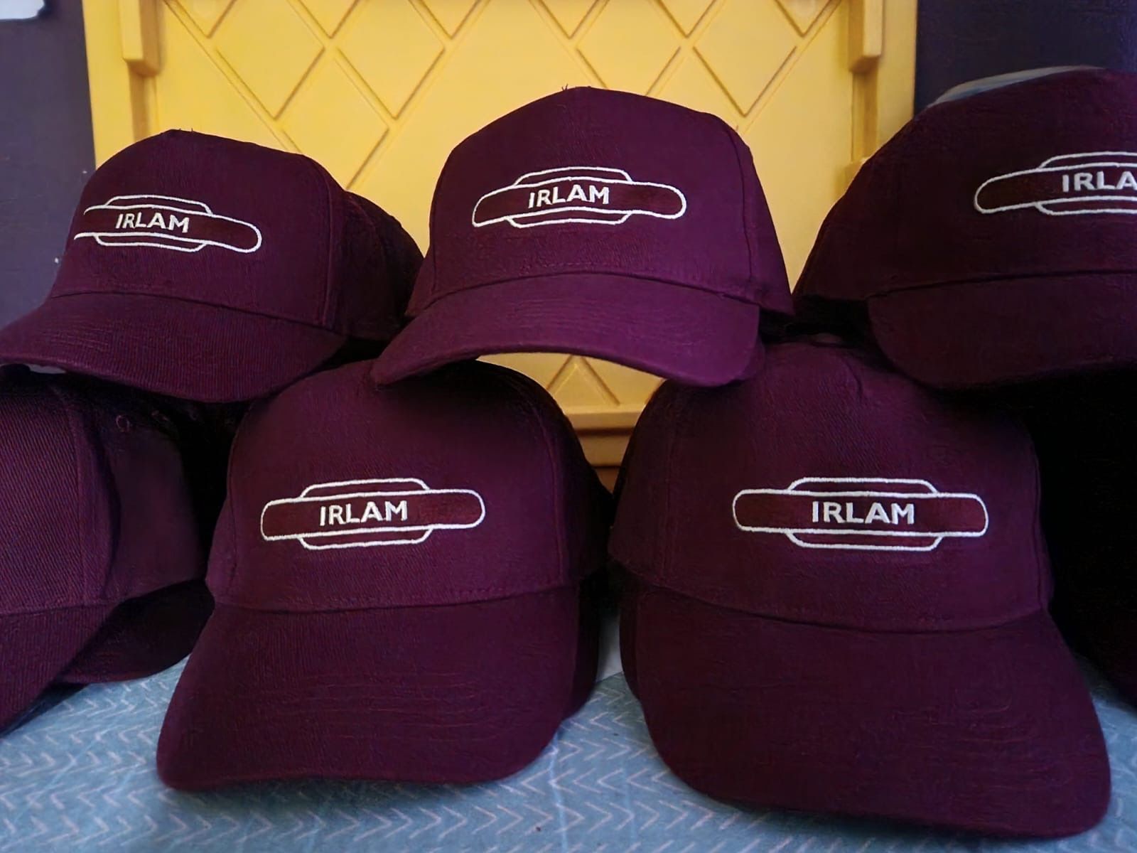 Maroon baseball caps with 