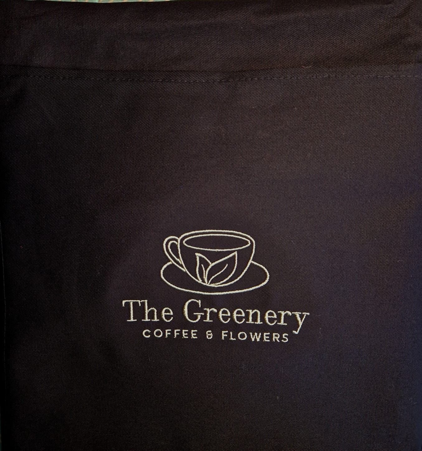 Dark blue tote bag with embroidered logo of a coffee cup with leaves, 