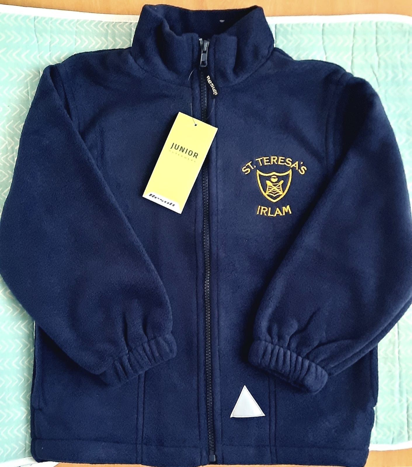 Navy blue school fleece jacket with school logo and zipper.