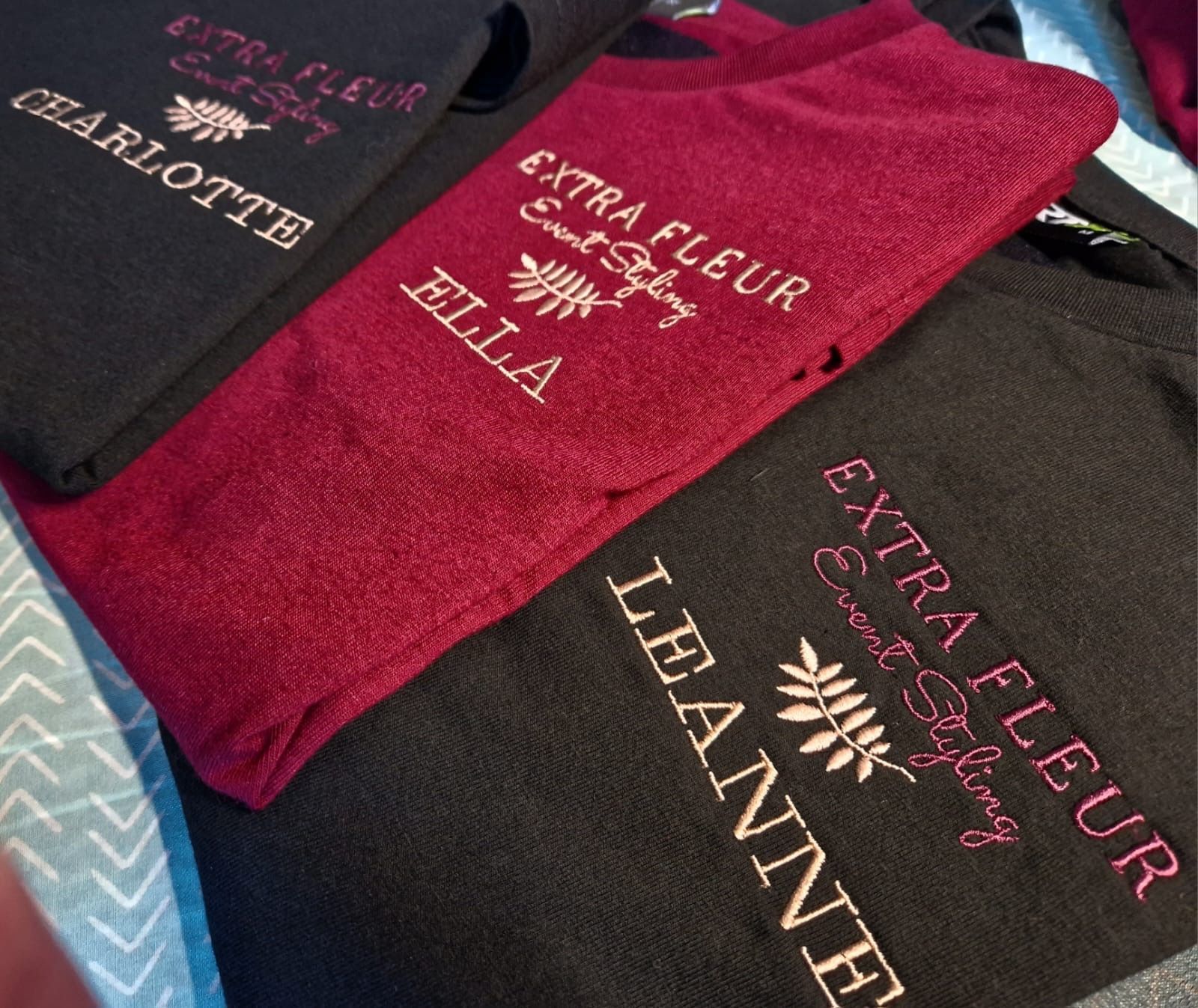 Embroidered towels in black and burgundy with names and 