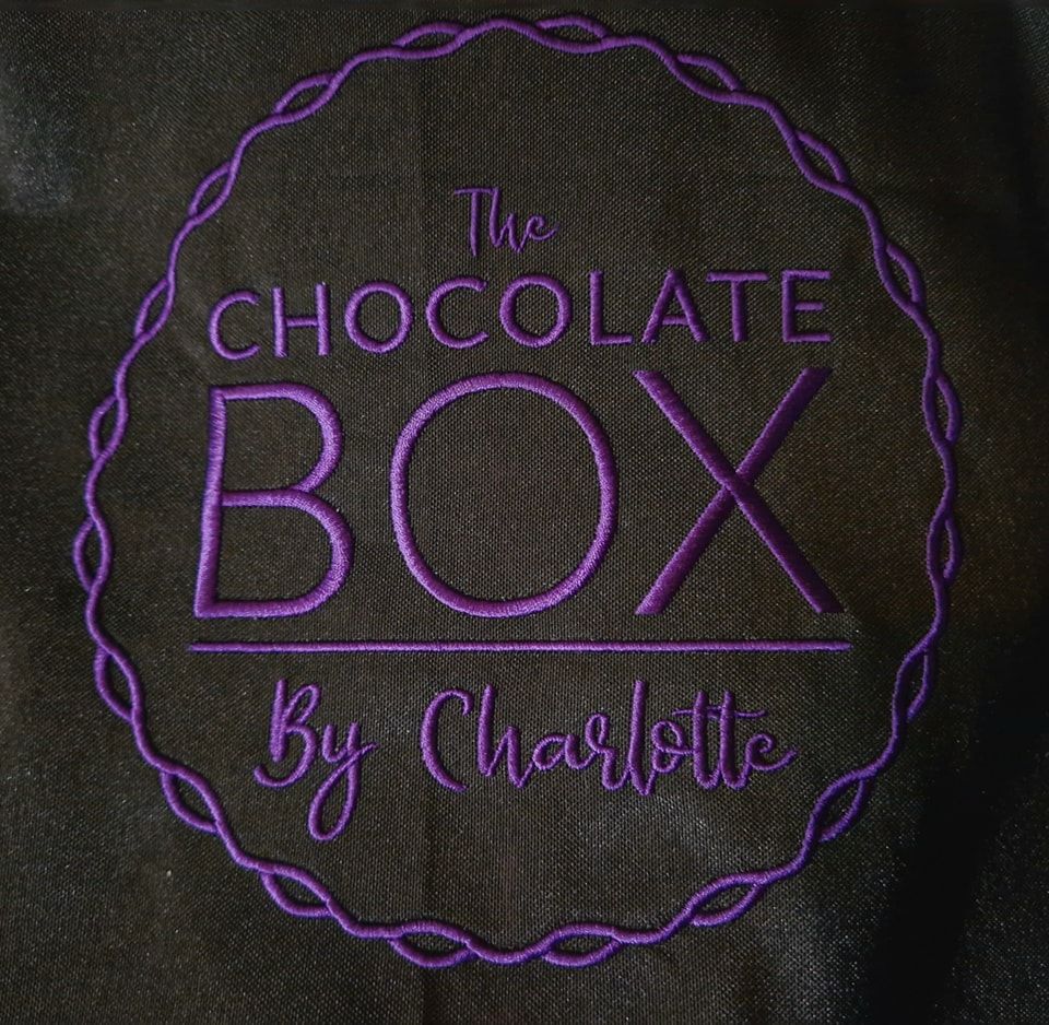 An embroidered logo for the chocolate box by charlotte