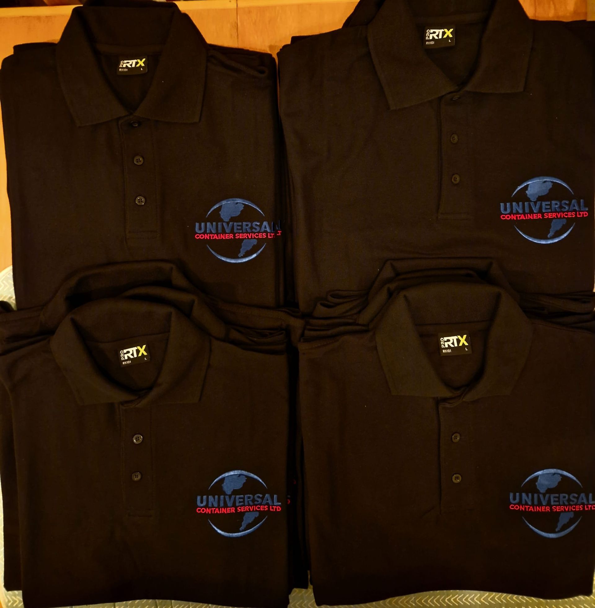Four black polo shirts with the 