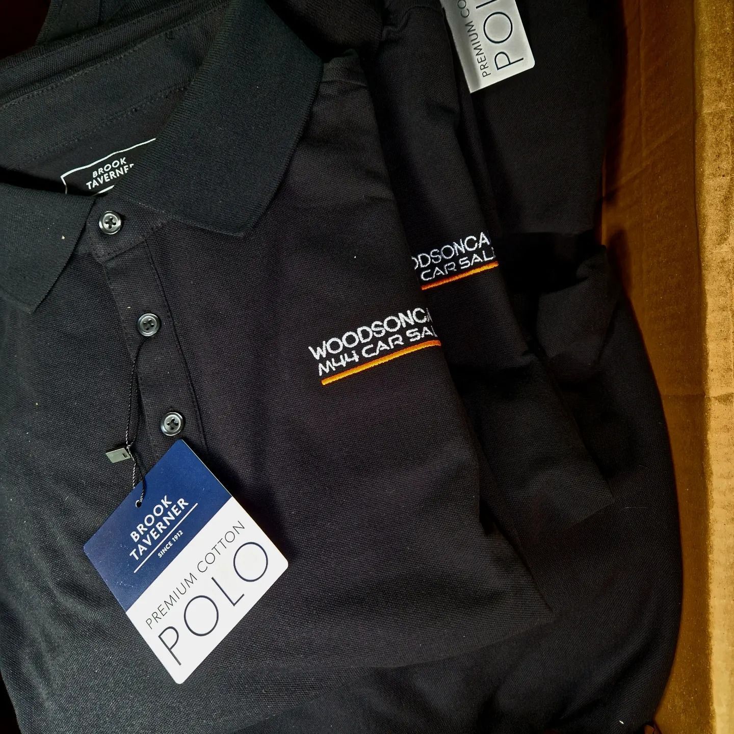 Two black polo shirts with 