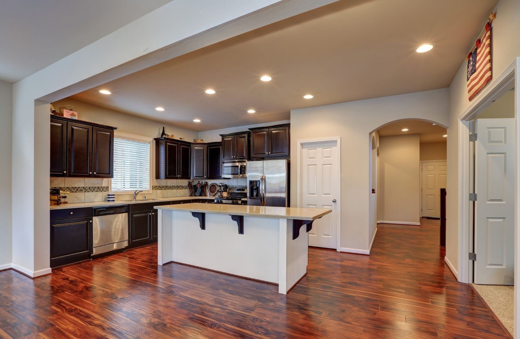 A kitchen with a large island in the middle of the room.