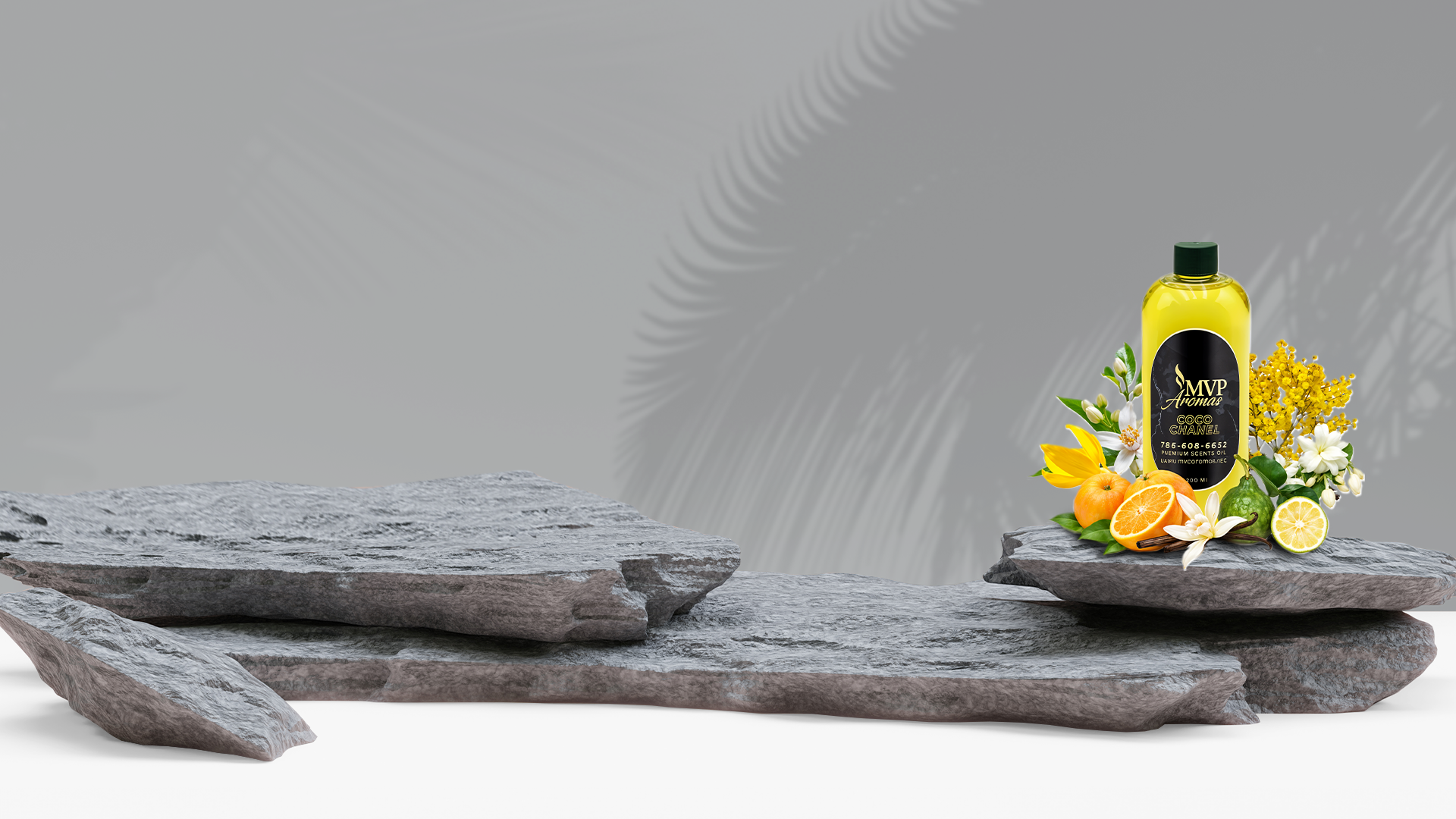 A bottle of juice is sitting on a stone shelf next to flowers.