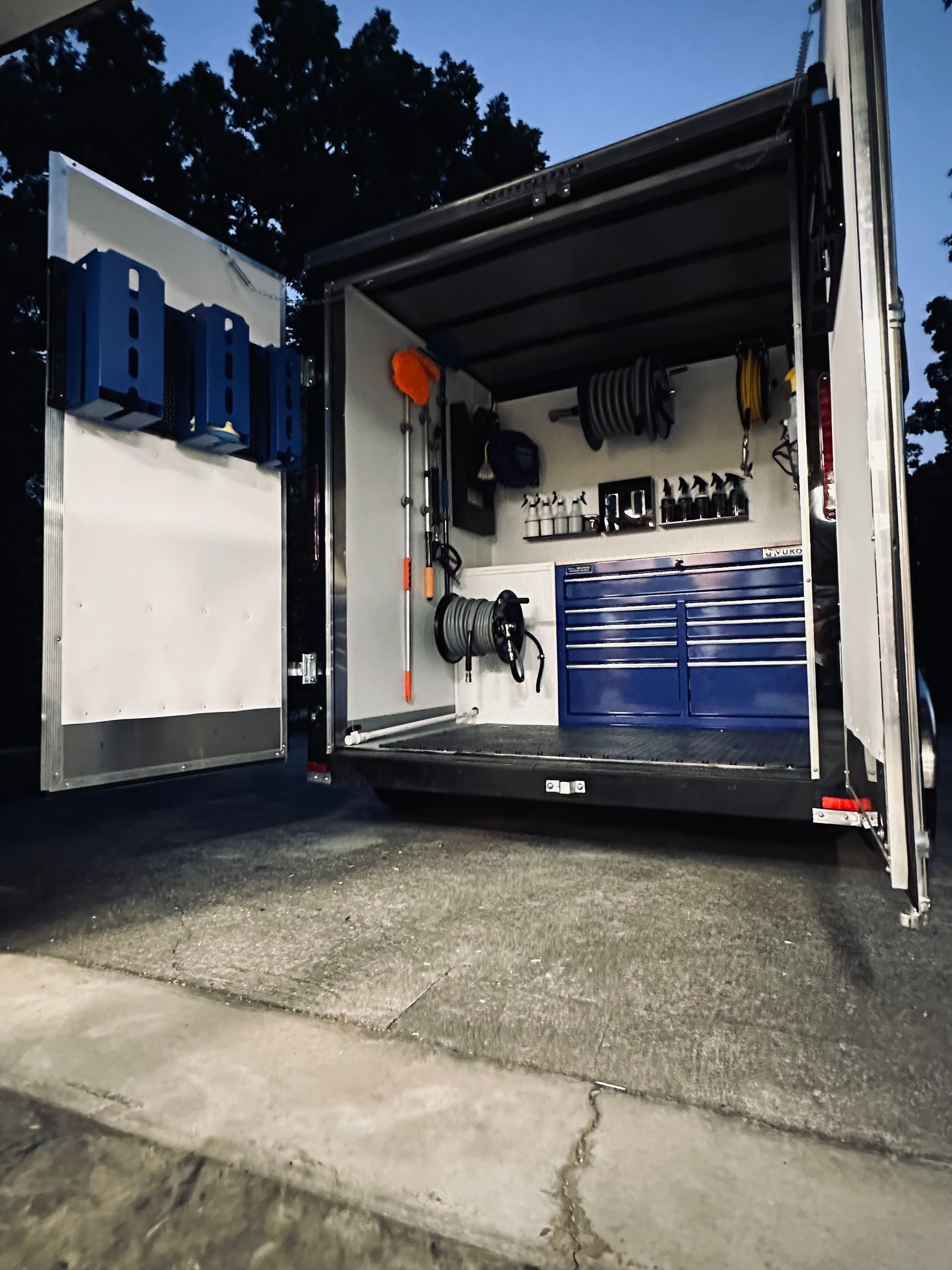 The inside of a trailer with the doors open