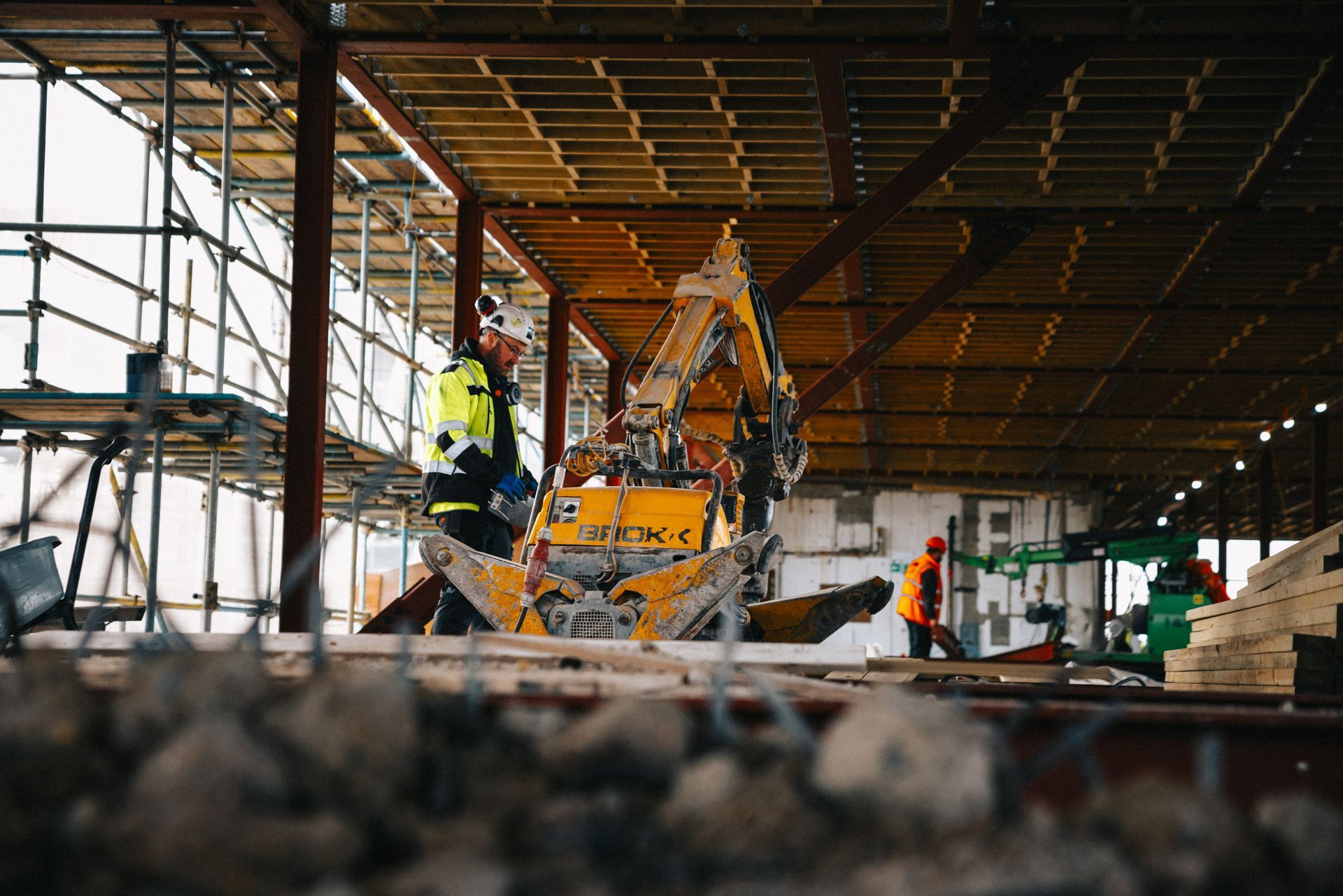 A group of construction workers are working on a building under construction.