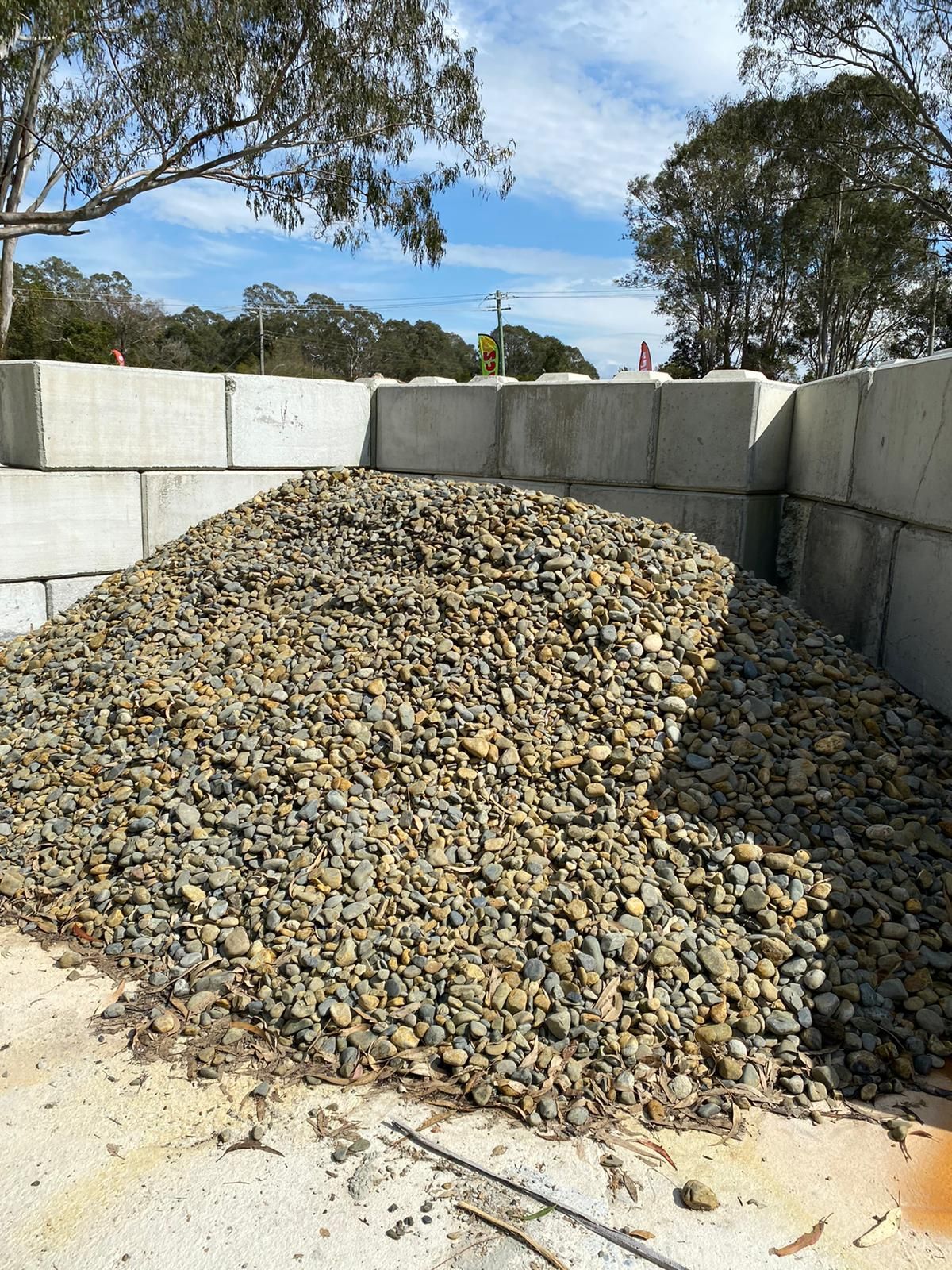 A Large Pile of Stones surrounding Brick Wall  — Black Rock Garden Centre In Tyagarah, NSW