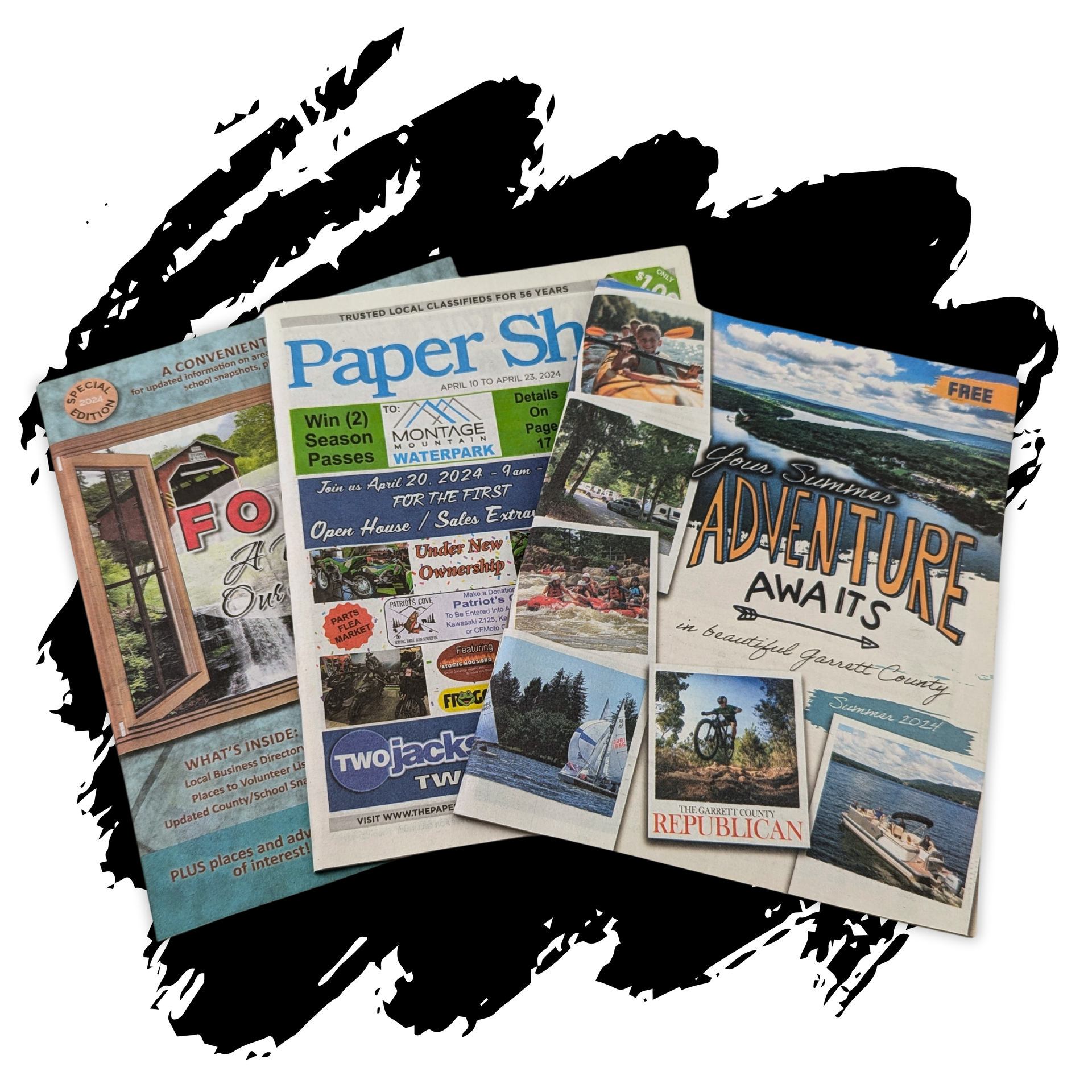 A group of magazines are sitting on top of each other on a table.